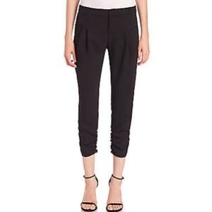 Black trousers with cinching at ankle